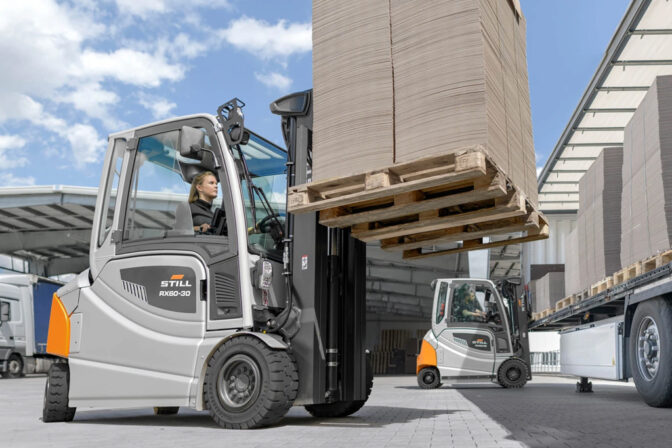 Forklift lifting heavy pallet load at O.rentals equipment yard Dubai